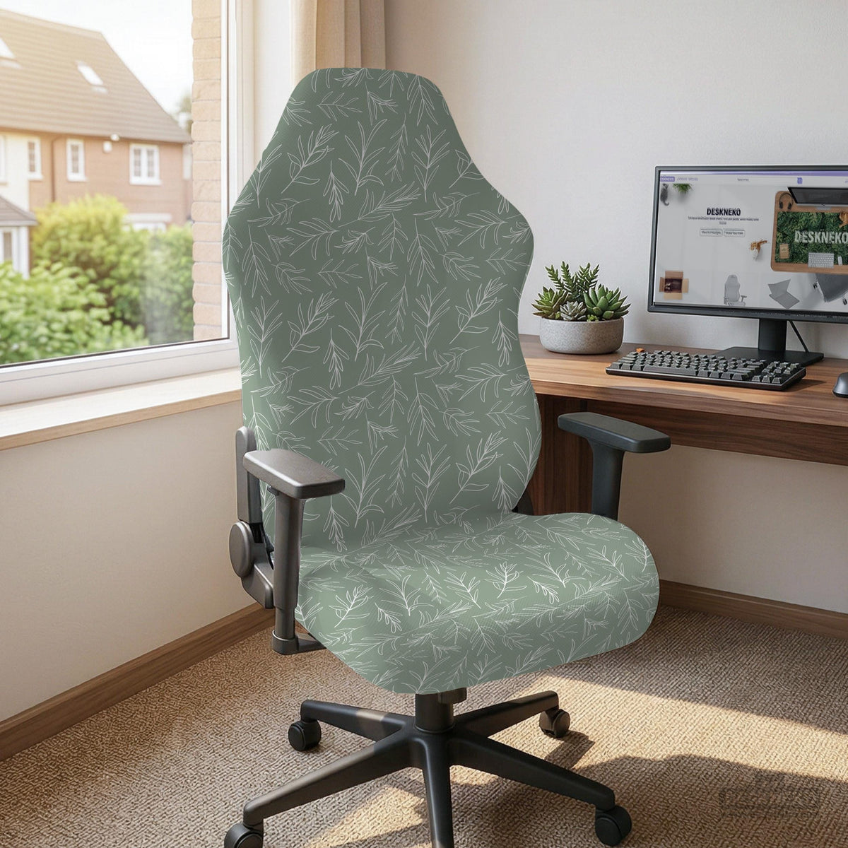 Office chair cover in muted sage green with a light leaf pattern on a white background.