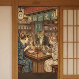 A split-panel Japanese noren curtain showing a ramen shop scene with three cats, warm lantern light, and vintage-style artwork in beige, muted teal, and brown tones.