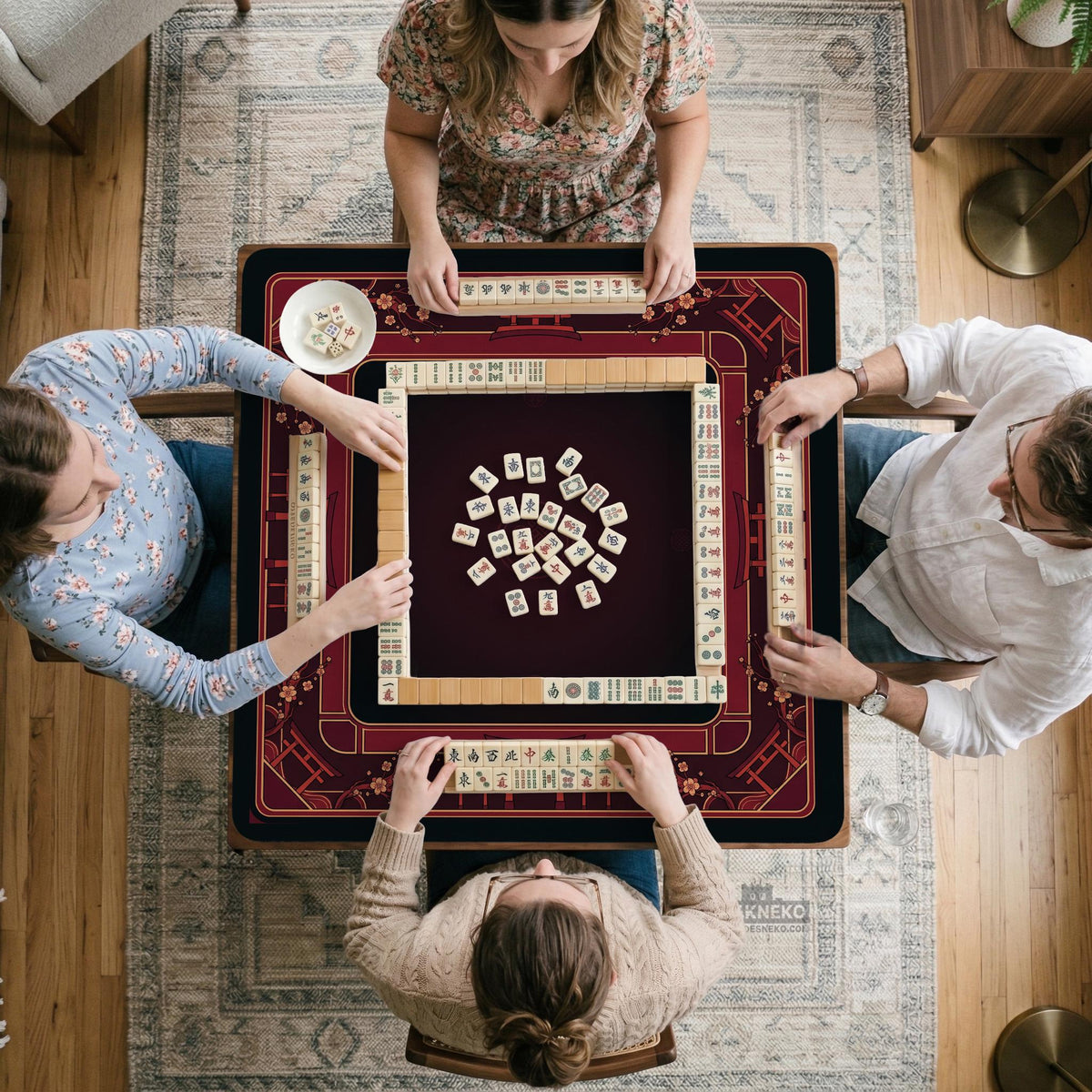 Square burgundy mahjong mat with a cherry blossom floral border and a dark open center.