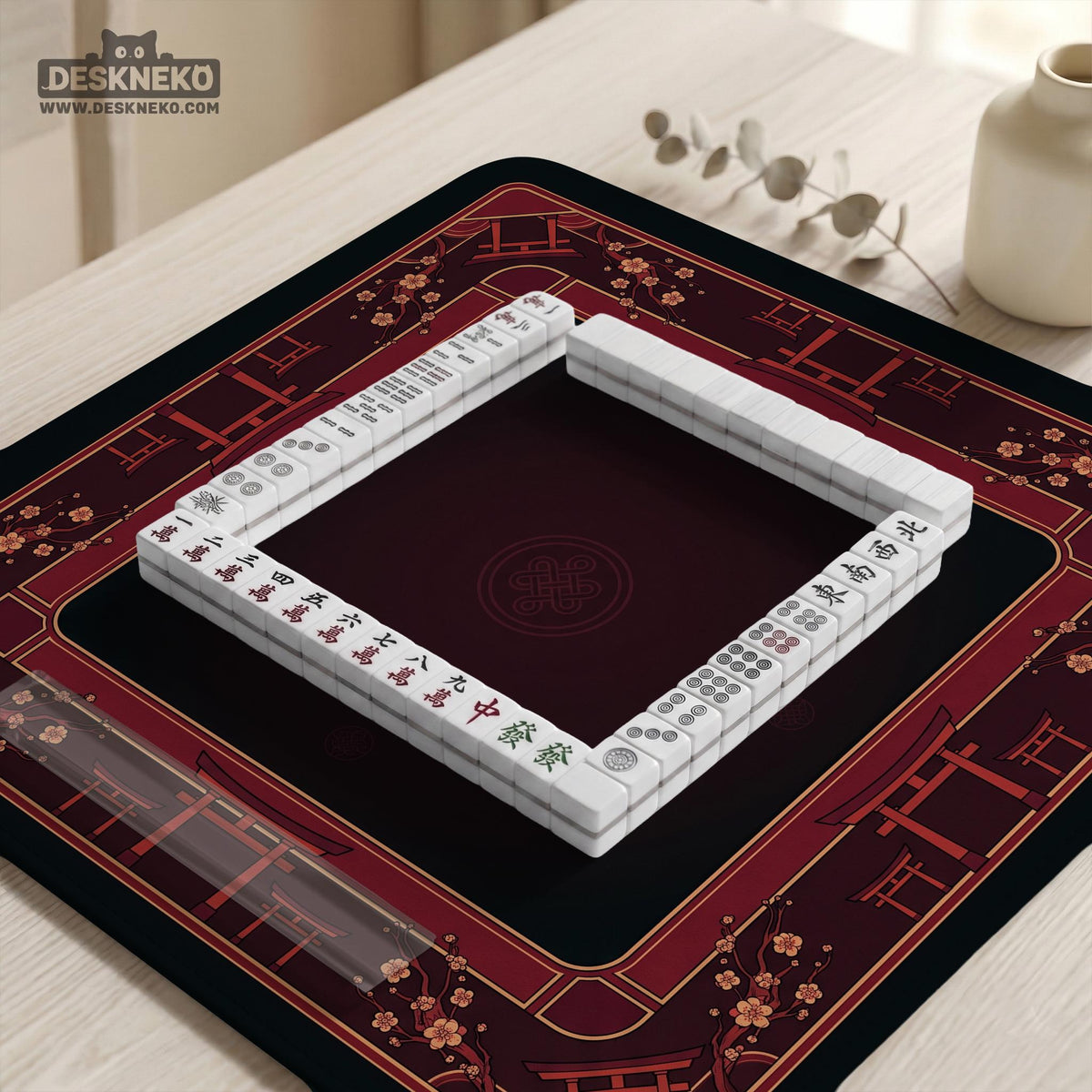 Square burgundy mahjong mat with a cherry blossom floral border and a dark open center.