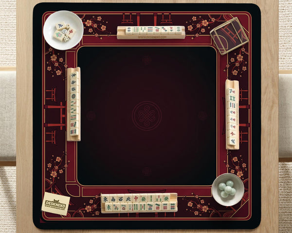Square burgundy mahjong mat with a cherry blossom floral border and a dark open center.