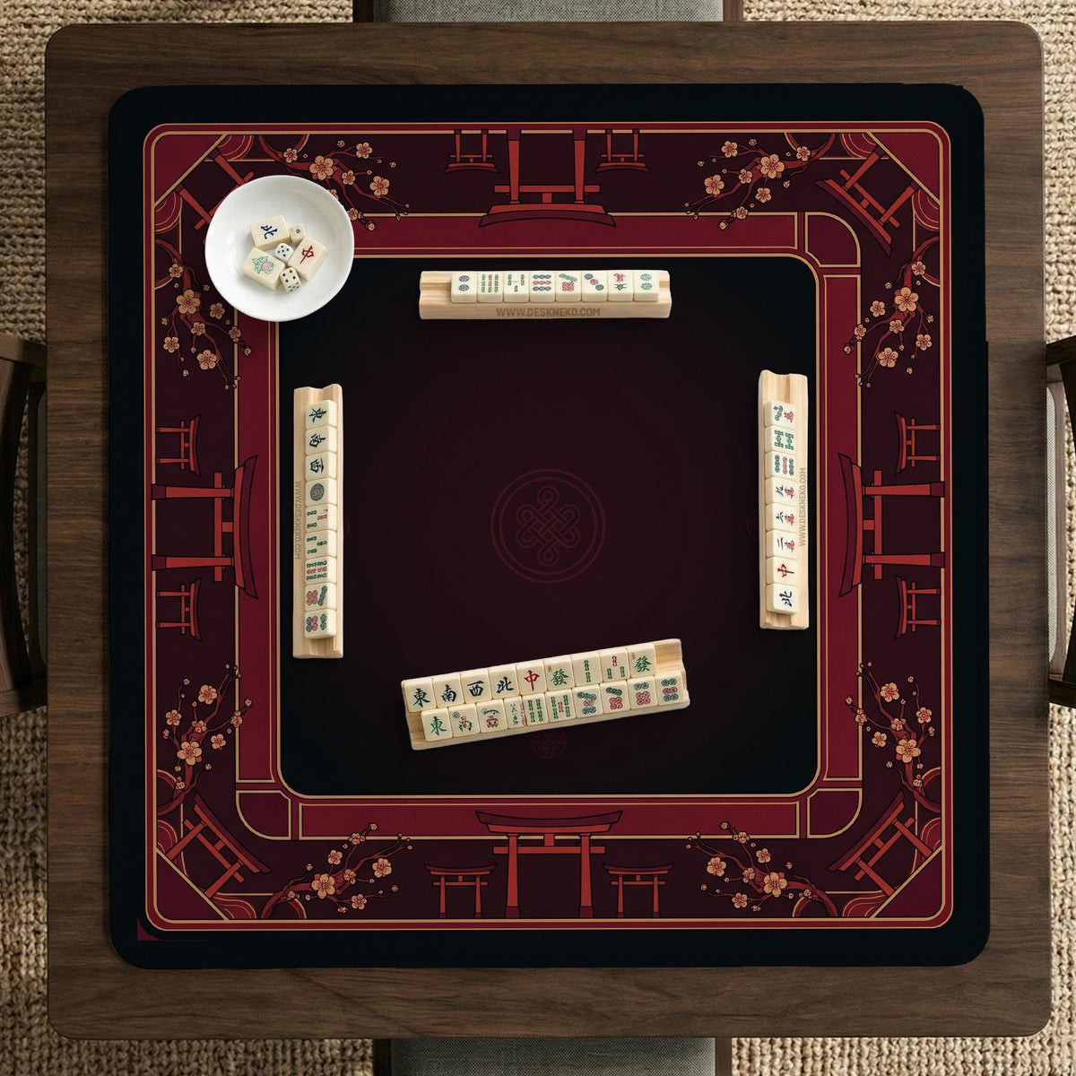 Square burgundy mahjong mat with a cherry blossom floral border and a dark open center.