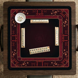 Square burgundy mahjong mat with a cherry blossom floral border and a dark open center.