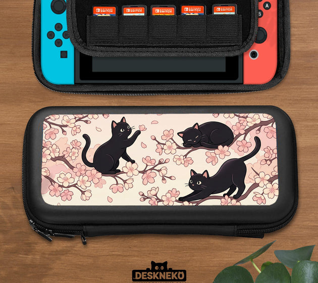 Switch case with black cats and cherry blossoms on a light pastel background.