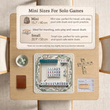 Square mahjong table mat with a cream center and a border design of cranes, bamboo, plum blossoms, and a geometric frame in sage green and warm gold.