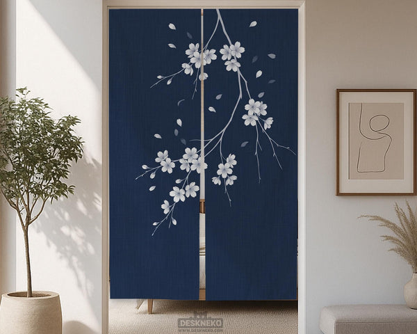 Navy door curtain with pink cherry blossom branches and a light floral layout on a dark background.
