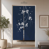 Navy door curtain with pink cherry blossom branches and a light floral layout on a dark background.