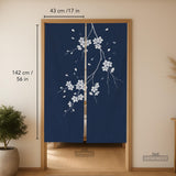 Navy door curtain with pink cherry blossom branches and a light floral layout on a dark background.