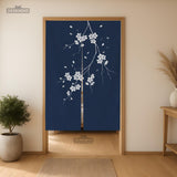 Navy door curtain with pink cherry blossom branches and a light floral layout on a dark background.