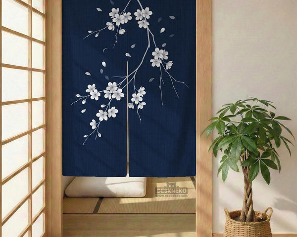 Navy door curtain with pink cherry blossom branches and a light floral layout on a dark background.