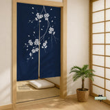 Navy door curtain with pink cherry blossom branches and a light floral layout on a dark background.