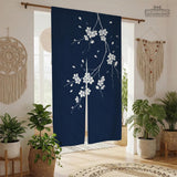 Navy door curtain with pink cherry blossom branches and a light floral layout on a dark background.