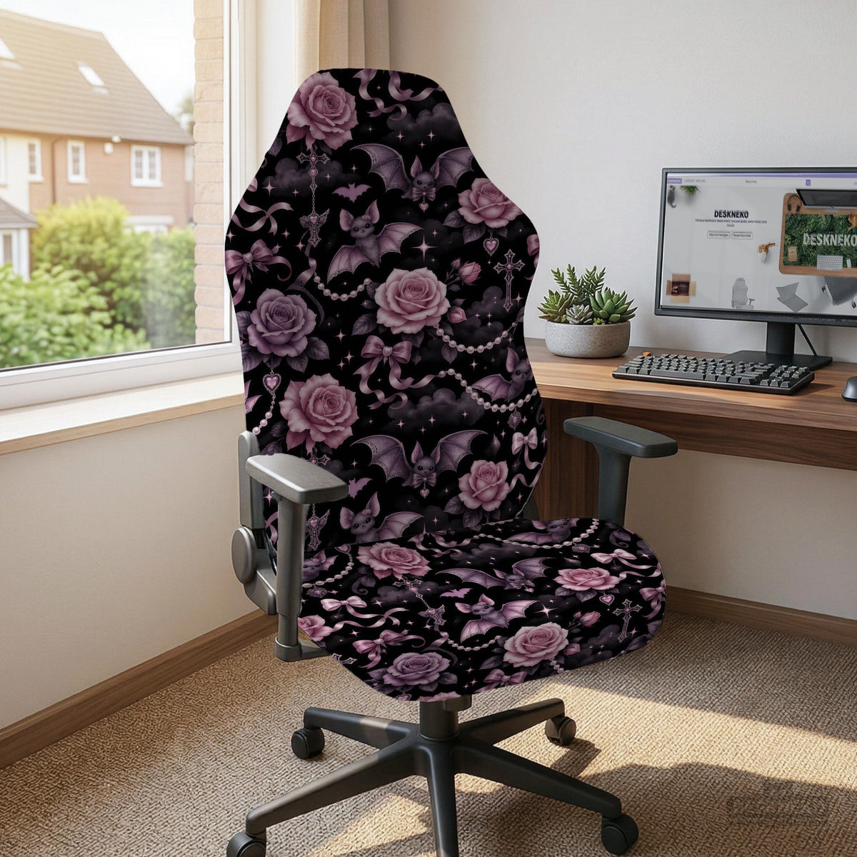 Desk chair cover design with pink roses, small bats, moons, pearls, and ribbon details on a black background.