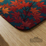 Square teal mahjong mat with koi fish, falling autumn leaves, and pond water artwork.