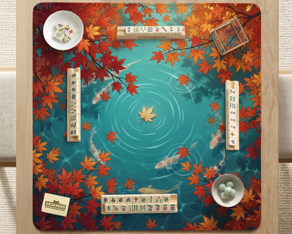 Square teal mahjong mat with koi fish, falling autumn leaves, and pond water artwork.