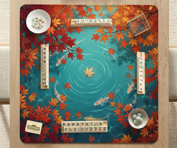 Square teal mahjong mat with koi fish, falling autumn leaves, and pond water artwork.
