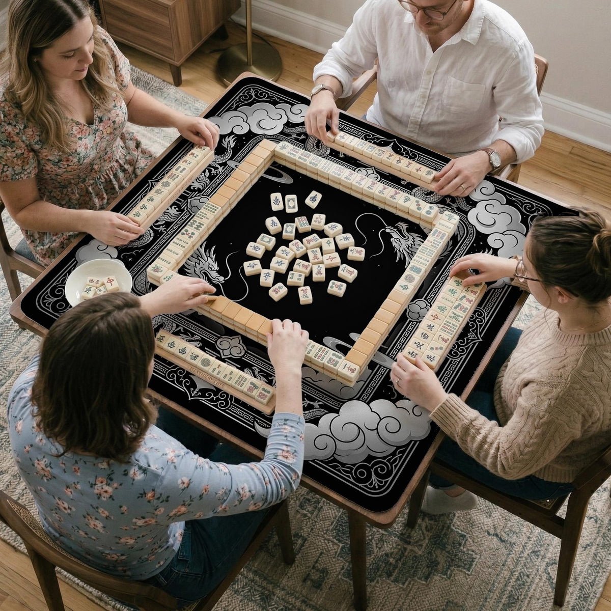 Square mahjong table mat with a black and silver dragon border, cloud details, and a scalloped edge.