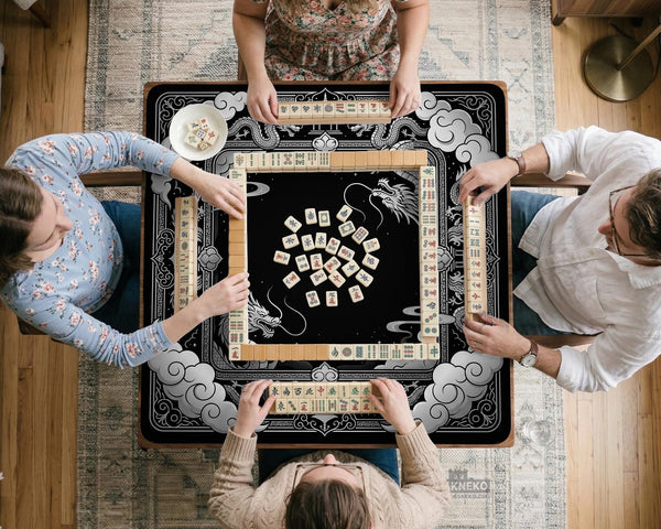 Square mahjong table mat with a black and silver dragon border, cloud details, and a scalloped edge.