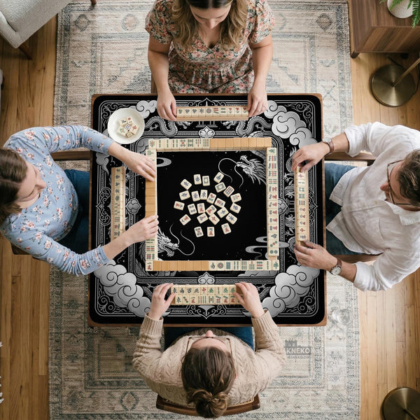 Square mahjong table mat with a black and silver dragon border, cloud details, and a scalloped edge.