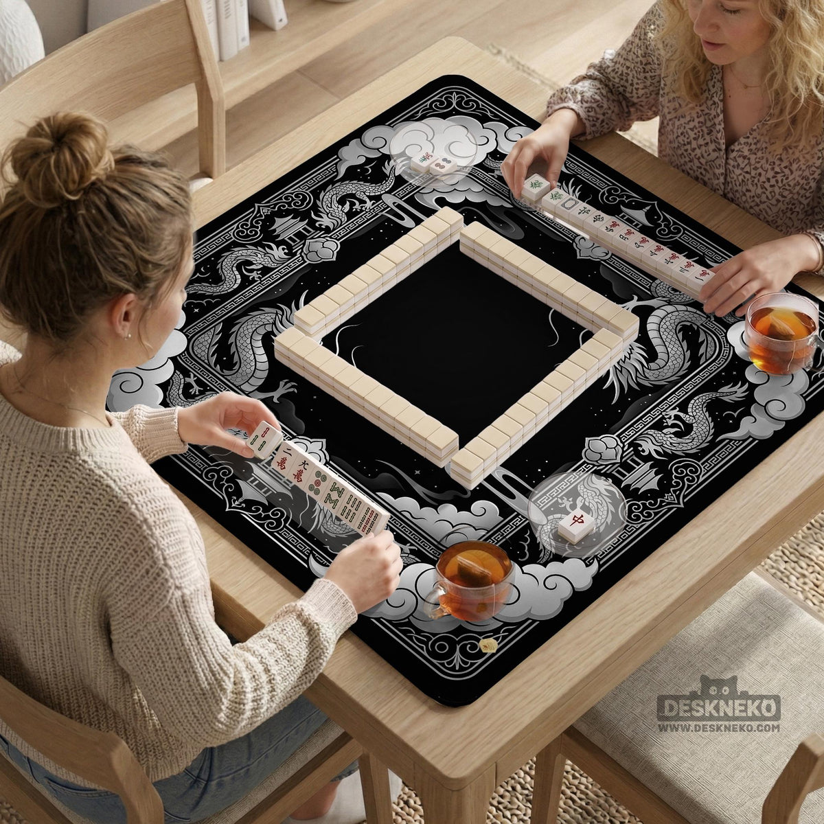 Square mahjong table mat with a black and silver dragon border, cloud details, and a scalloped edge.