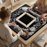 Square mahjong table mat with a black and silver dragon border, cloud details, and a scalloped edge.