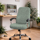 Office chair cover in muted sage green with a light leaf pattern on a white background.