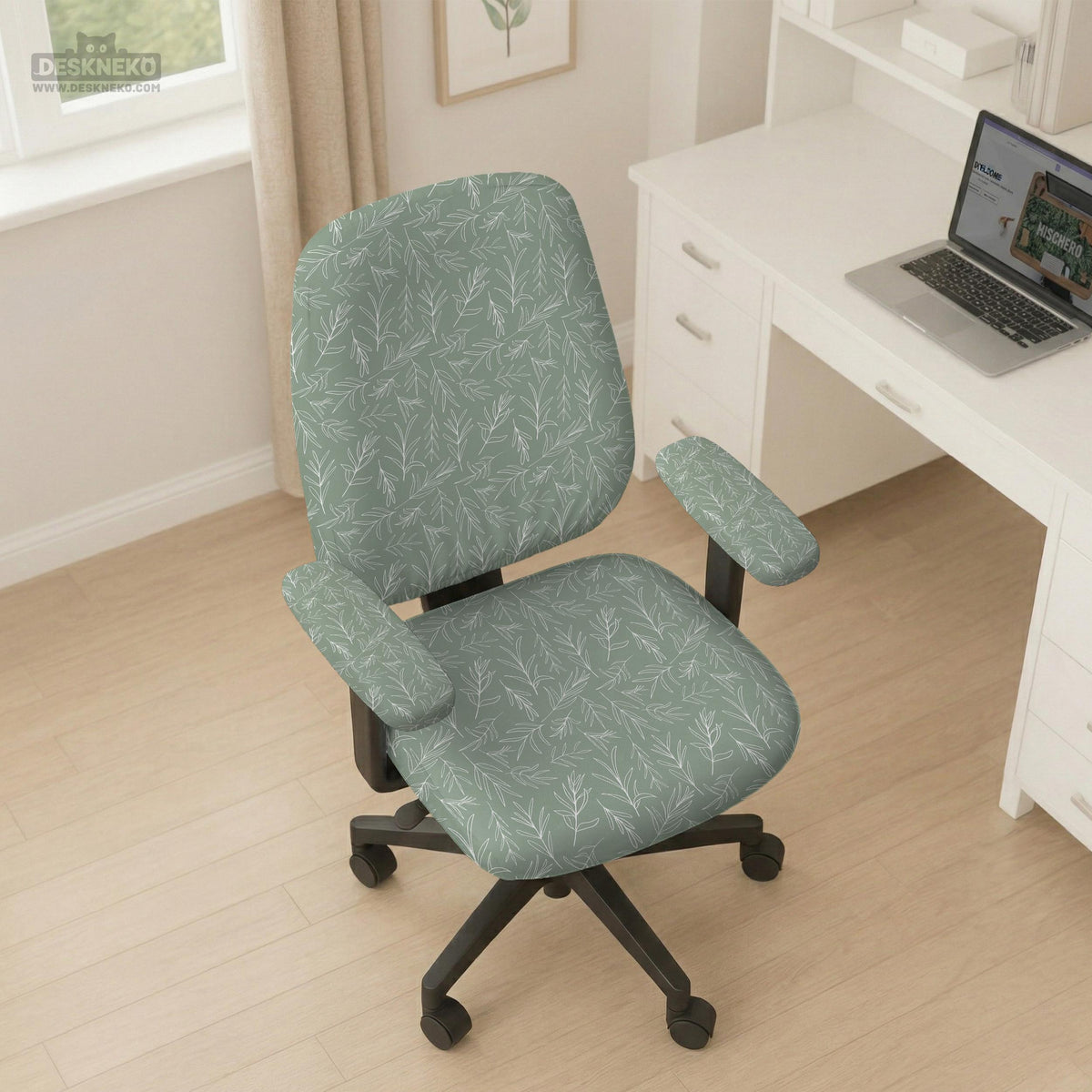 Office chair cover in muted sage green with a light leaf pattern on a white background.