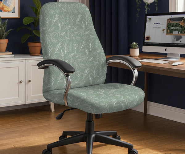 Office chair cover in muted sage green with a light leaf pattern on a white background.
