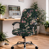 Green chair cover with a dark floral pattern, pink roses, cream flowers, and leafy botanical details on an office chair.