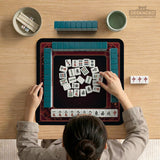 Square burgundy mahjong mat with a cherry blossom floral border and a dark open center.