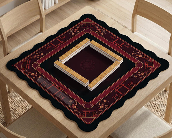 Square burgundy mahjong mat with a cherry blossom floral border and a dark open center.