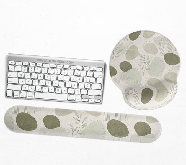 Green abstract botanical mouse pad with a rounded organic pattern and matching keyboard wrist rest option.