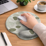 Green abstract botanical mouse pad with a rounded organic pattern and matching keyboard wrist rest option.
