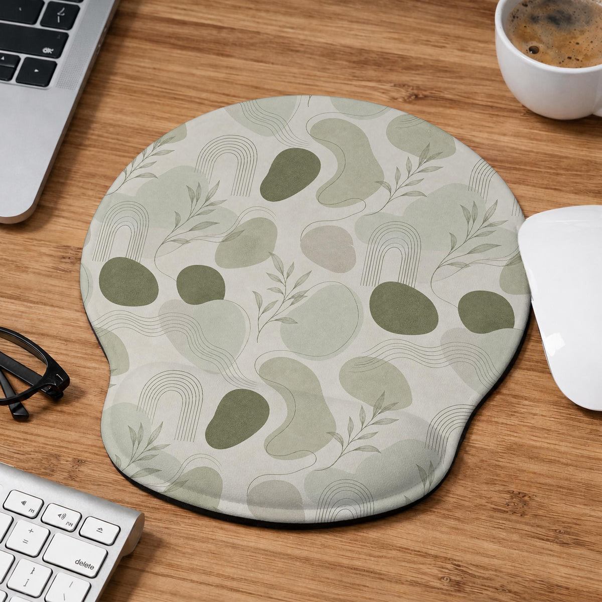 Green abstract botanical mouse pad with a rounded organic pattern and matching keyboard wrist rest option.