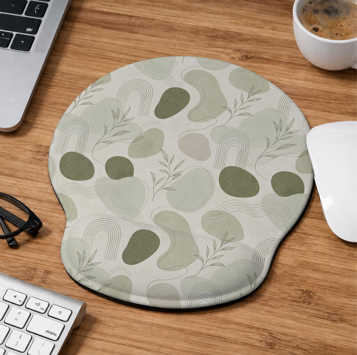 Green abstract botanical mouse pad with a rounded organic pattern and matching keyboard wrist rest option.