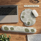 Green abstract botanical mouse pad with a rounded organic pattern and matching keyboard wrist rest option.