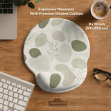 Green abstract botanical mouse pad with a rounded organic pattern and matching keyboard wrist rest option.