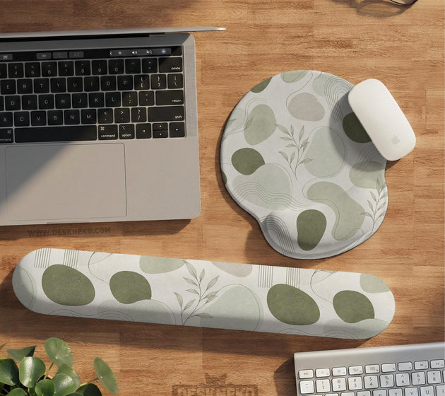 Green abstract botanical mouse pad with a rounded organic pattern and matching keyboard wrist rest option.
