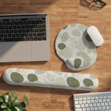 Green abstract botanical mouse pad with a rounded organic pattern and matching keyboard wrist rest option.