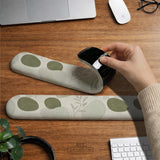Green abstract botanical mouse pad with a rounded organic pattern and matching keyboard wrist rest option.