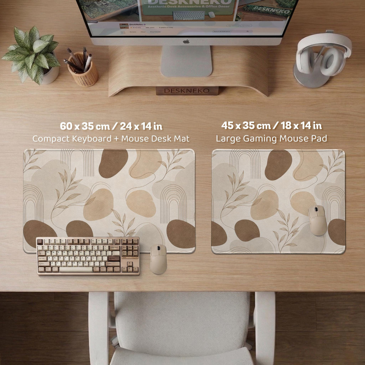 Beige desk mat with fine botanical line drawings and soft abstract shapes on a light neutral background.