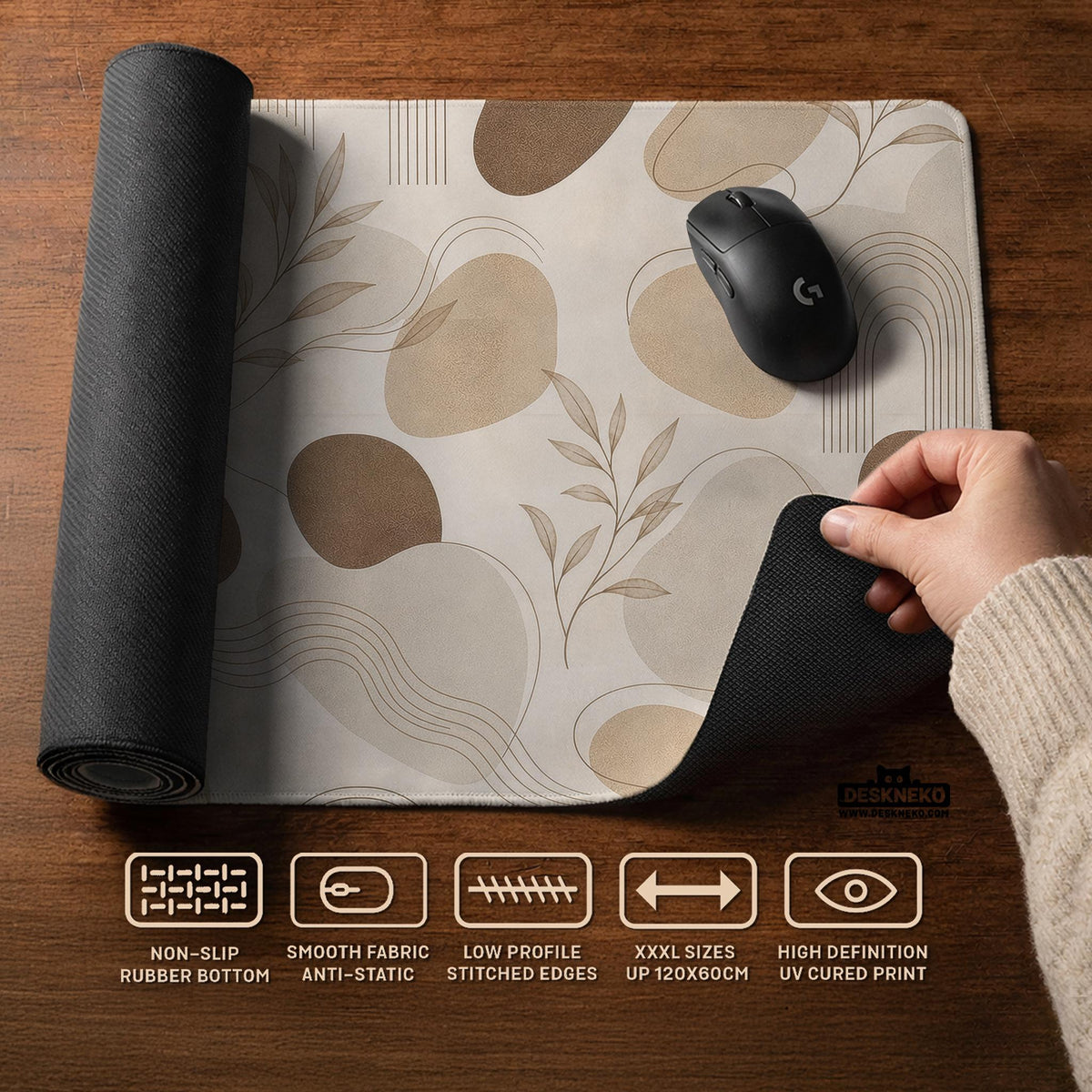 Beige desk mat with fine botanical line drawings and soft abstract shapes on a light neutral background.