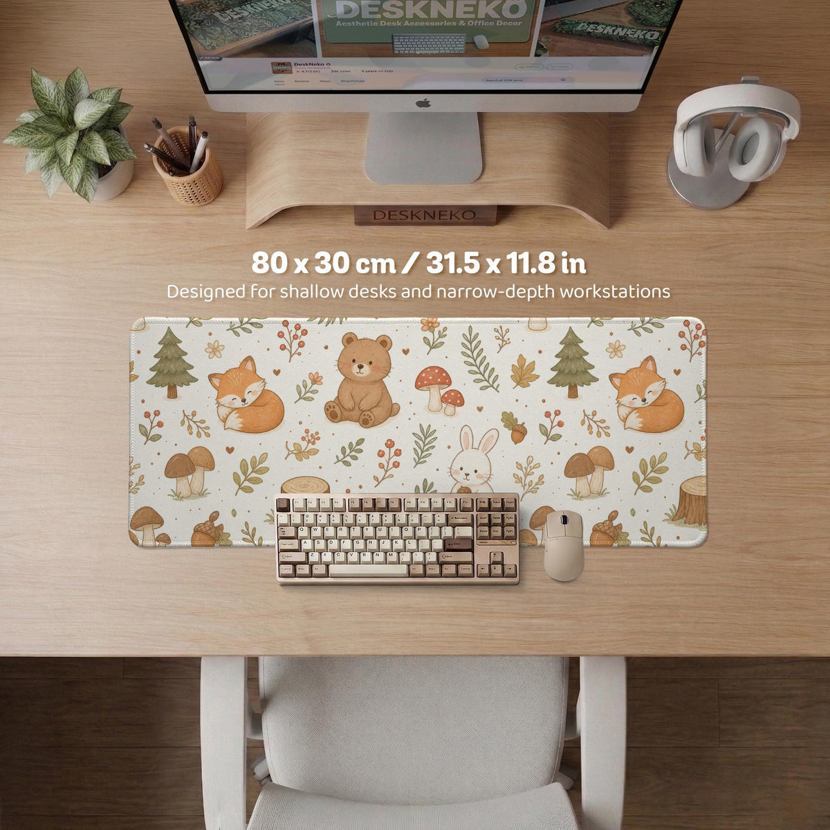 Cream desk mat with a woodland animal pattern featuring foxes, bunnies, mushrooms, berries, acorns, and sage leaves in soft green tones.