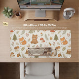 Cream desk mat with a woodland animal pattern featuring foxes, bunnies, mushrooms, berries, acorns, and sage leaves in soft green tones.