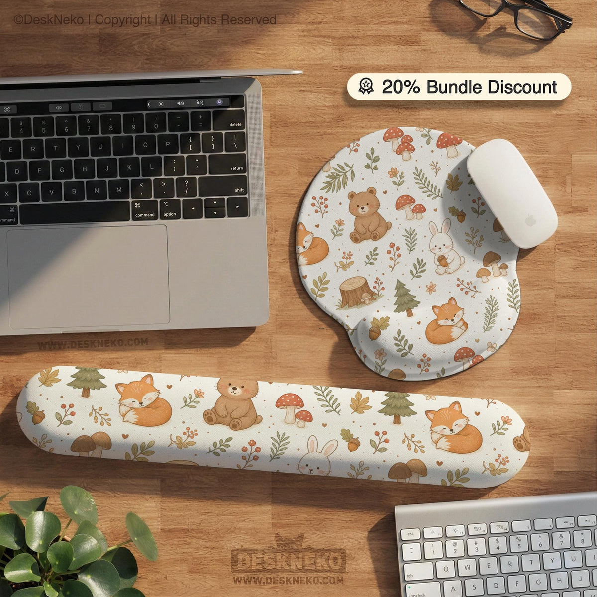 Cream desk mat with a woodland animal pattern featuring foxes, bunnies, mushrooms, berries, acorns, and sage leaves in soft green tones.