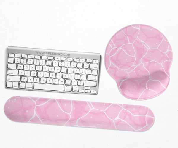 Soft pink mouse pad and wrist rest with a cloud-marble pattern, pale linework, and small star details.