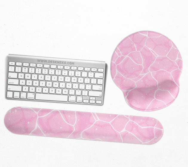 Soft pink mouse pad and wrist rest with a cloud-marble pattern, pale linework, and small star details.