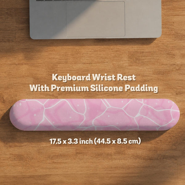 Soft pink mouse pad and wrist rest with a cloud-marble pattern, pale linework, and small star details.