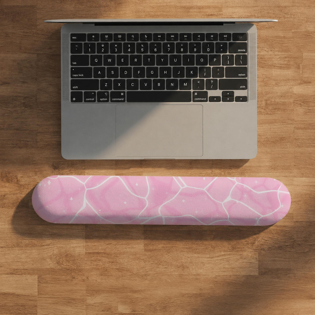 Soft pink mouse pad and wrist rest with a cloud-marble pattern, pale linework, and small star details.
