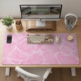 Soft pink desk mat with a kawaii cloud-marble pattern, white crackle lines, and small star accents.